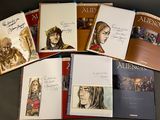 a lot of books that are sitting on a table