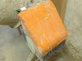 a cement mixer with a cement bag on the back of it