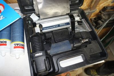 a tool box that has a hammer and other tools in it