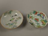 pair of chinese porcelain bowls with birds and flowers painted on them