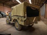 a military vehicle that is parked in a garage