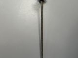 an old sword with a gold handle on a white surface