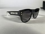 christian dior sunglasses in black and white with a star on the side