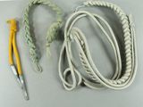 a rope, a crochet, and a crochet hook on a table
