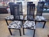 four black and white chairs with black and white patterns on them