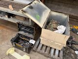 a box of tools sitting on a pallet in a garage
