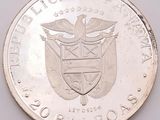a close up of a coin with a coat of arms on it