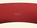 a close up of a red belt on a white background