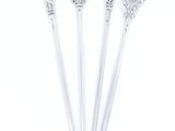 three silver spoons with ornate designs on them on a white background