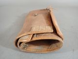 a brown leather wallet with a small hole in it