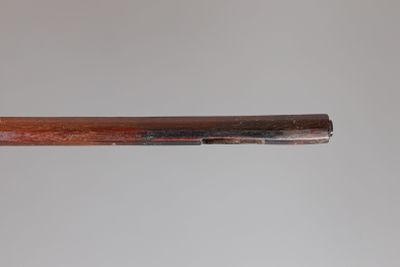 a close up of a baseball bat with a wooden handle
