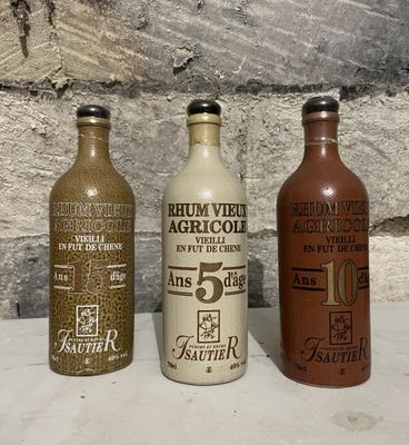 three bottles that are sitting next to each other on a table