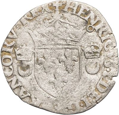 a silver coin with a crown on top of it