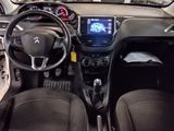the interior of a small car with a steering wheel and dashboard