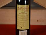 a bottle of wine that is sitting on a table