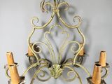 wall sconce in the shape of a chandelier with three candles