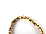 gold plated bracelet on a white background with a white background