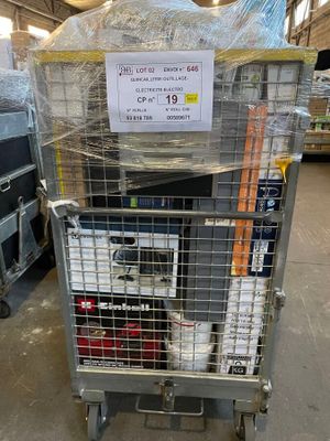 a metal cart with a sign on it in a warehouse