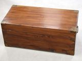 a wooden box that is sitting on a white surface
