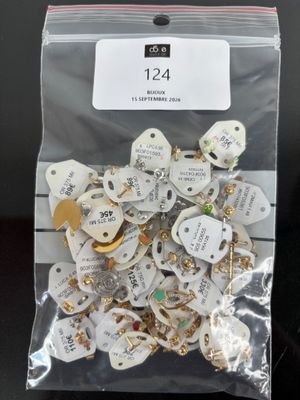 a bag of assorted jewelry on a table