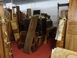 many pieces of furniture in a room with a red carpet