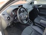 the interior of a small car with a steering wheel and dashboard