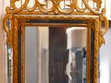 a mirror that is sitting on a table in a room