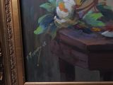 a picture of a painting of flowers on a table