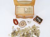 a wooden box with coins and a mirror on it