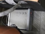 a cell phone sitting on top of a seat in a car