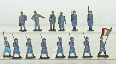 many figurines of men in blue uniforms on display