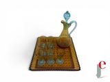 a small tray with a pitcher and glasses on it