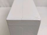 a white box sitting on top of a white table