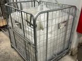 a large metal cage with a lot of bags inside of it