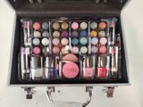 a suitcase filled with makeup and cosmetics items