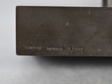 a close up of a piece of metal on a table