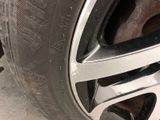 the rim of a car with a flat tire on it