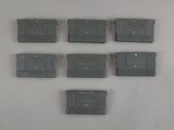 six nintendo game cartridges sitting on top of a table next to each other