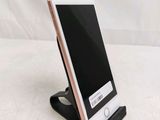 an iphone is sitting on top of a stand with a barcode on it
