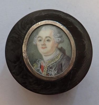 a picture of a miniature portrait of a man in a suit