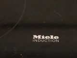 black and white photo of a close up of the logo of a mixer