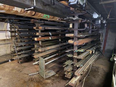 many pieces of wood stacked on top of each other in a warehouse