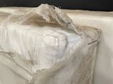 a mattress that has been wrapped in a plastic bag