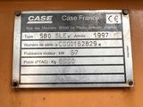 a close up of a metal sign on the side of a building