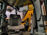 an image of a tractor with a seat in the back of it