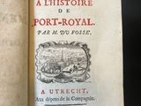an open book with a picture of a town on it