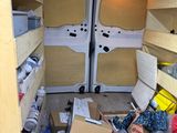 a van with a lot of stuff in the back of it