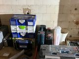 a pile of tools and other items in a room