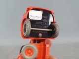 a person holding a toy truck with wheels in their hand