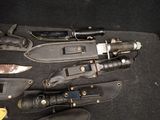 many different types of knives and knives in a case
